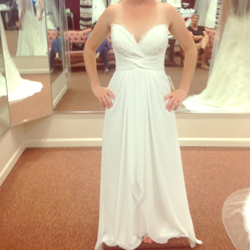 Beautiful strapless ivory wedding gown.